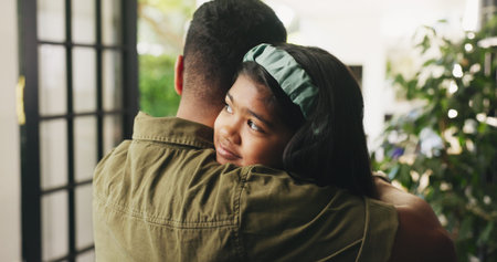 Dad, child or hug with greeting in home for love, safety or care together by door or entrance....