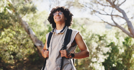 Thinking, man and hiking for fitness in forest with smile, adventure and sightseeing on holiday....