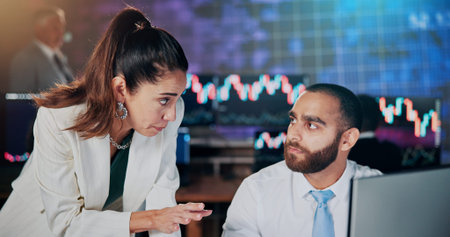 Woman, man and trading with computer at office with discussion, review or charts at finance company....