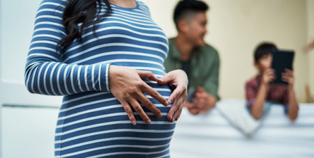 Family, pregnant woman or heart hands on stomach in house for prenatal care, baby growth or bonding. Love sign, people and future mom with belly connection for maternity support and healthy pregnancyの写真素材