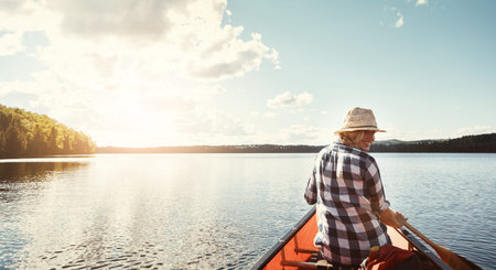 Rowing, kayak and back of woman in lake for adventure, vacation and tourist activity on holiday. Space, water sports and person in canoe on river, nature and outdoor for journey, hobby and travelの写真素材