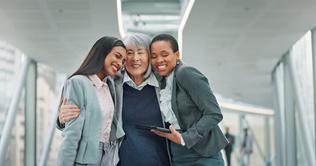 Happy, business people or women in office with hug for success, leadership or manager satisfaction....
