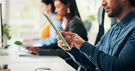Man, tablet and hands in office with reading for project management at web design company. Business...