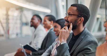 Business people, meeting and smile in conference, workshop or presentation for feedback at office. Group, employees and audience with thinking in team training for support seminar at workplaceの写真素材