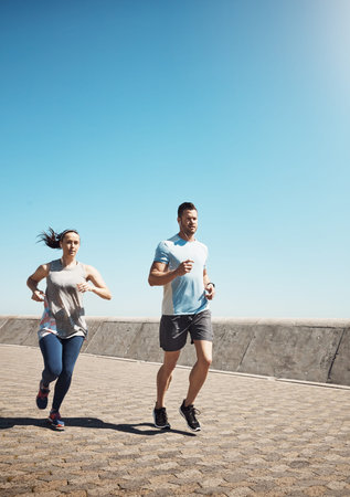 Promenade, running and couple with training, exercise for wellness and earphones. Support, healthy...
