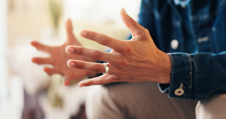 Hands, consultation and person in therapy for anxiety, counseling session or advice for support. Psychology, mental health patient and man with stress in office, talking and appointment for traumaの写真素材