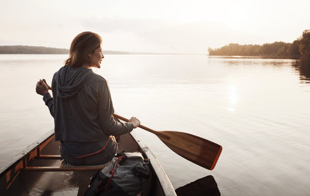 Thinking, woman and smile with canoeing on lake for travel adventure, sightseeing nature. Sunshine,...