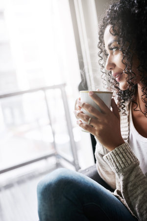 Thinking, woman and rest with coffee at window for vision, start day and calm morning. Space, female...