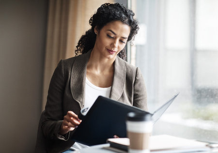 Reading, folder or business woman in coffee shop, remote work or public record information for...