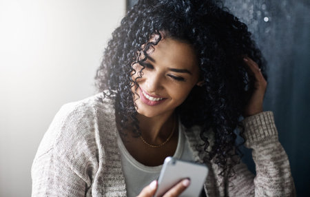 Woman, smile and texting with phone in house with contact, web chat and click for online dating....