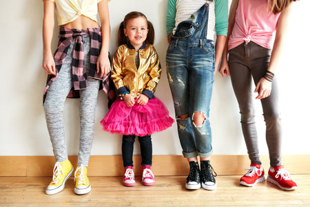 Portrait, child or friends by wall with fashion, stylish clothing or bonding together for...