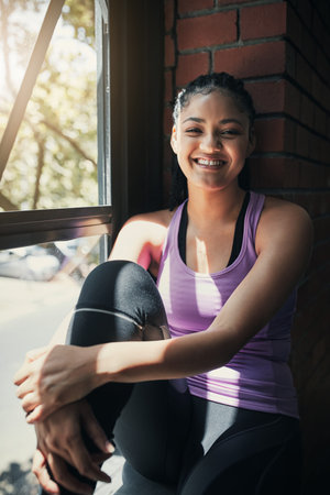 Fitness, portrait or African woman in gym with smile, pride or progress in physical exercise. Happy,...
