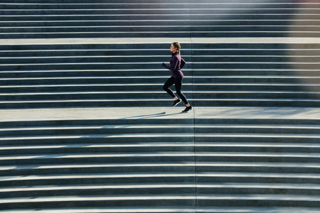 Fitness, running or woman on stairs for workout, morning practice or endurance challenge for...