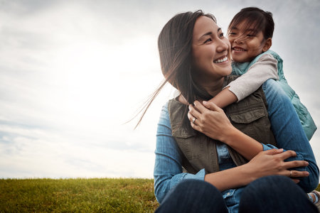 Asian mother, hug and kid in nature with smile, love and bonding together with affection. Space,...
