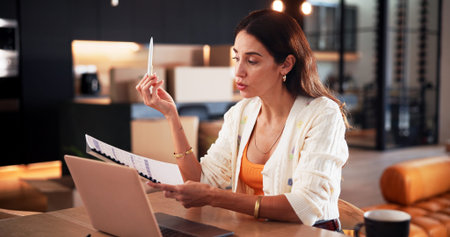 Laptop, journalist and woman with proposal in home for video call, article and remote work. Communication, freelancer and mature person with project, paperwork and planning for story editor in houseの写真素材