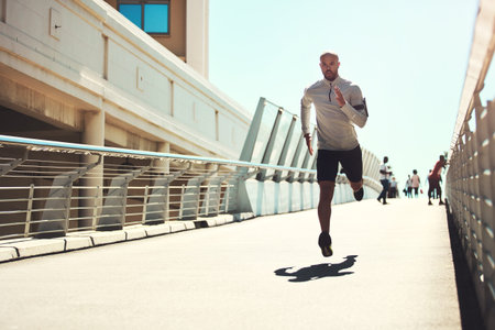 Serious, man and running for fitness outdoor for exercise, training and physical activity in city....