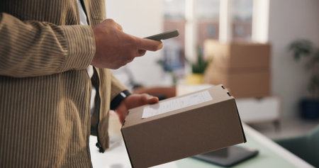 Person, hands and phone scanner with box for logistics, delivery tracking or confirmation in home....