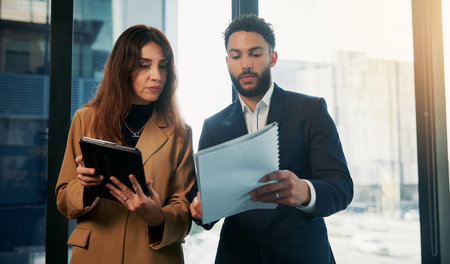 Tablet, documents and business people in office, conversation to check profit and investor. Talking,...