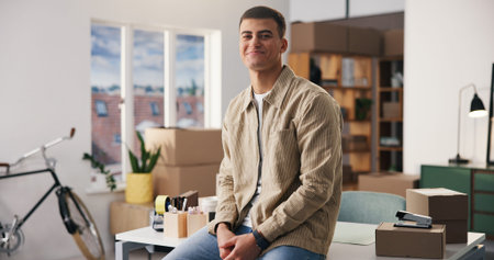 Portrait, man and smile at small business with logistics, career pride and about us for ecommerce. Happy, male entrepreneur and confident with boxes, supply chain and ambition of package distributionの写真素材