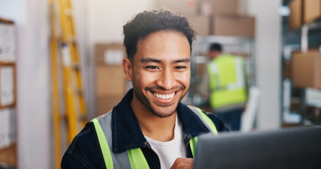 Logistics, man and smile in warehouse with laptop, shipping update or good news for package...