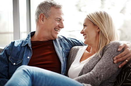 Love, relax and smile with couple on sofa for marriage, bonding and support together. Peace,...