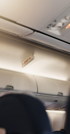 Airplane, cabin and exit sign for travel with safety for flying, transport services or global...