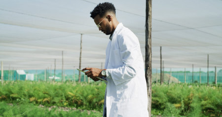Scientist, man and research with tablet on farm for crop management, pest control or reporting....