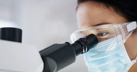 Lab, glasses and woman with microscope, science and medical research for vaccine development or...