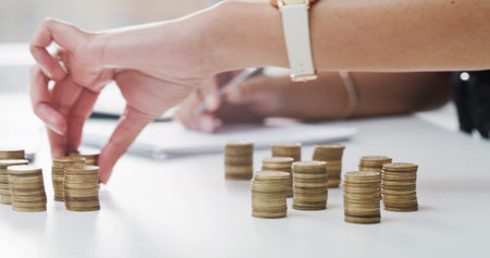 Budget, hands and counting coins in office for financial planning, petty cash funds and audit trail....