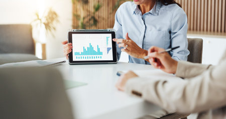 Hands, presentation and tablet screen with financial advisor in office boardroom for data review....
