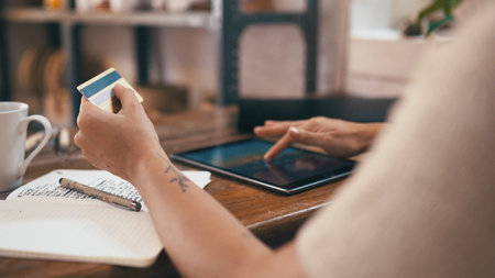 Credit card, tablet and hands of woman in office with buying supplies for startup business. Digital...