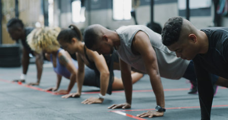 Exercise, push up and row with people in gym together for class, course or training routine....