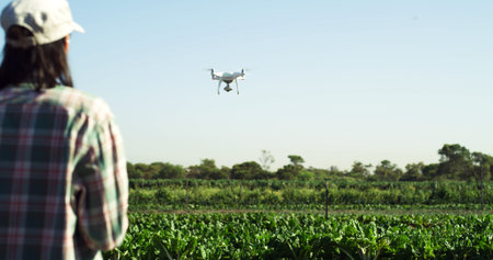 Agriculture, drone and back of woman on farm for field mapping, monitor crops and labor efficiency....