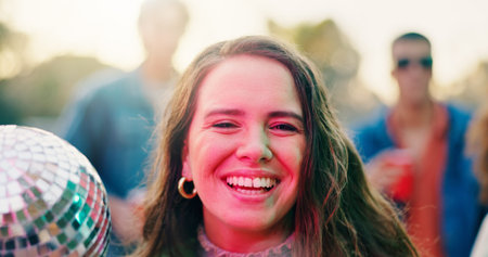Portrait, smile and woman with disco ball at party, friends social event and get together for...