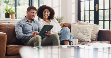 Happy couple, relax or sofa with tablet in home for budget planning or online investment. Man, woman...
