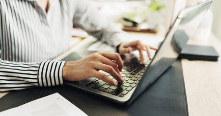 Typing, online and hands with laptop, creative and planning for story on web, project or journalism....