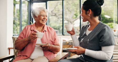 Caregiver, conversation and drinking tea in nursing home with old woman, visit and bonding together....