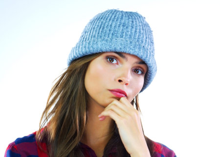 Knit, portrait or woman in studio with beanie, fashion or warm style in winter outfit. Space,...