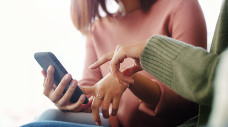 Women, friends or hands in home with phone, share social media post or bonding together on weekend....