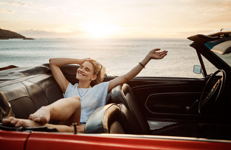 Road trip, rest or woman in car with beach sunset, outdoor destination or relax on tourist vacation....