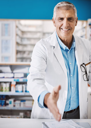 Handshake, happy and portrait of man in pharmacy for greeting, deal or medical advice at drugstore....