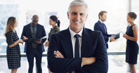 Portrait, investor and man in office, arms crossed and career ambition for economy growth. Mature...