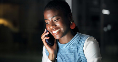 Night, phone call and smile of business black woman in office for communication or update....