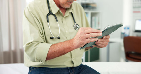 Tablet, doctor and hands with man in office of hospital for telehealth advice, medical diagnosis or...