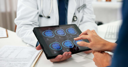 Brain scan, hands and tablet screen with people in hospital for radiology or results review....