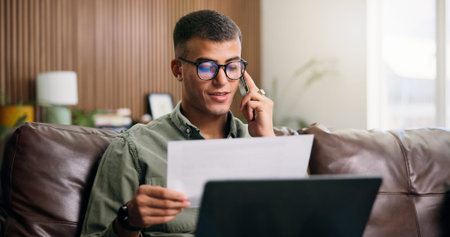 Happy man, documents and phone call with laptop on sofa for financial planning, audit or investment....