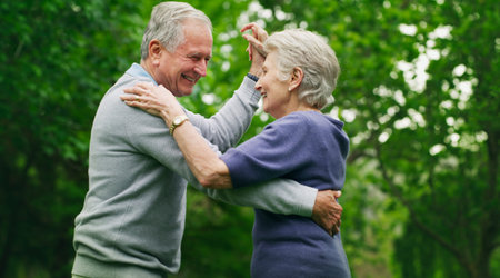 Dancing, love and old couple in park, happiness and bonding together for relationship. Nature,...