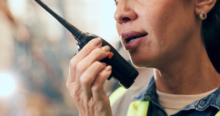 Woman, talking and warehouse with radio for logistics, supply chain or storage in depot. Female person, supplier or distributor with audio signal, sound or communication for distribution or shippingの写真素材