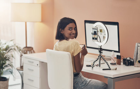 Portrait, makeup influencer or woman in home, ring light for content creation or social media for...