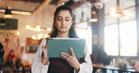 Tablet, manager and woman in restaurant for online inventory, update website and orders. Small...